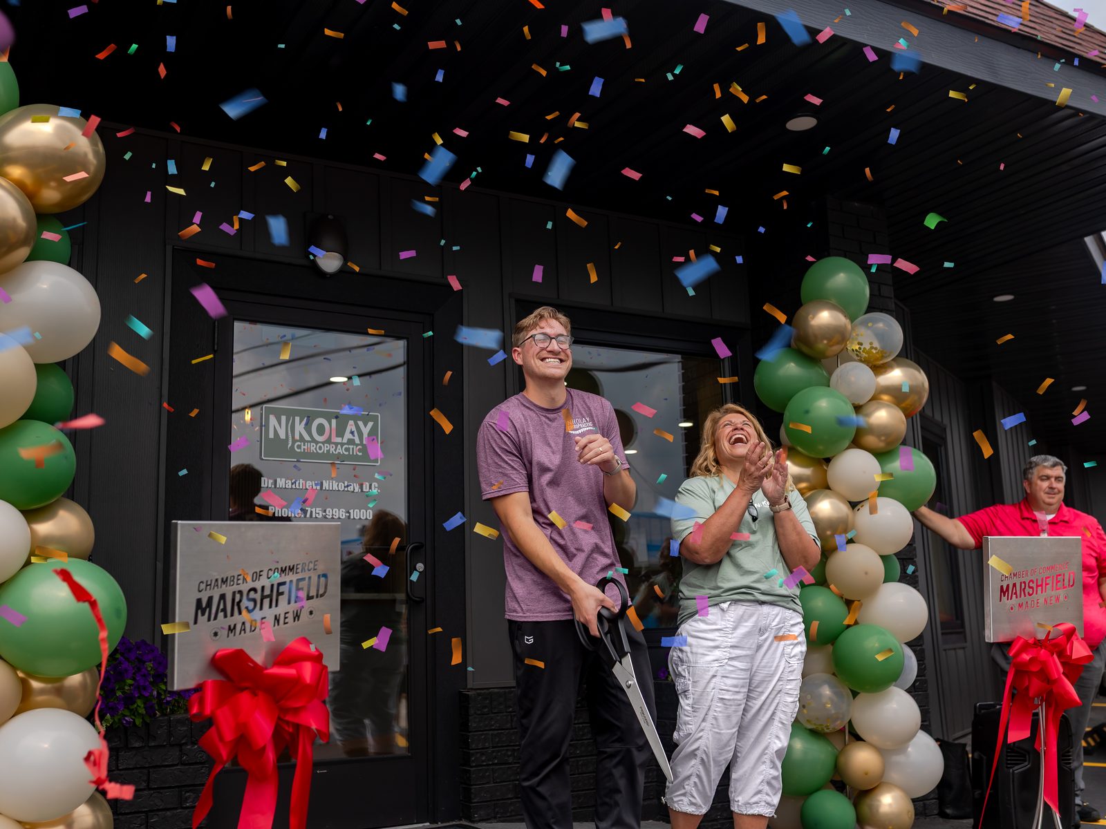 Dr. Matt and Michelle cutting the ribbon at the new clinic